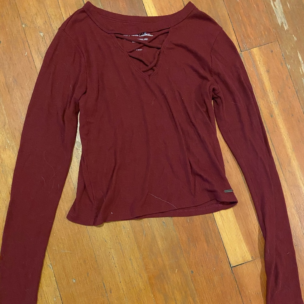 This is a tight fitting Marroon long sleeve shirt